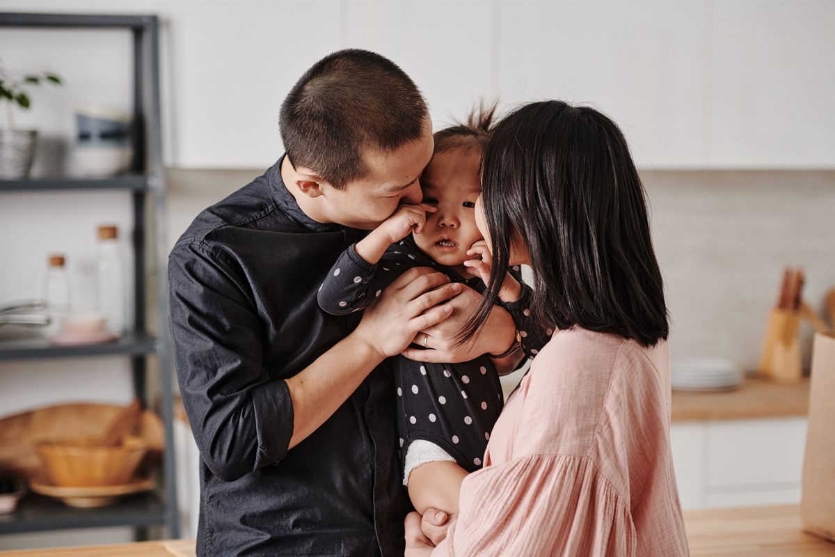 Parents with their daughter at home