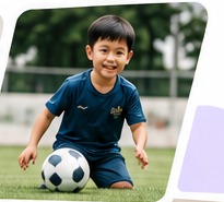 Asian child playing football
